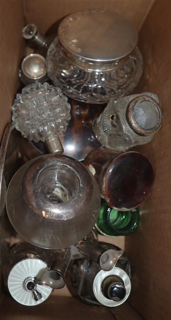 A quantity of assorted silver mounted items including scent bottles, toilet jars condiment bottles etc.